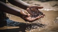 Handful Of Water Scarsity for Africa Symbol. Hand of an African black boy with water pouring Royalty Free Stock Photo
