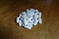 Handful of white calcium citrate tablets