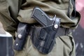 Handgun on the belt of a serviceman Royalty Free Stock Photo