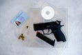 A handgun with bullets symbolizing gun rights while framed against the United States constitution. Royalty Free Stock Photo