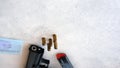 A handgun with bullets symbolizing gun rights while framed against the United States constitution. Royalty Free Stock Photo