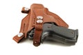 Handgun in a leather holster