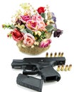 Handgun pistol and flower on white background Royalty Free Stock Photo