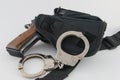 Handgun in tactical SWAT holster with handcuffs Royalty Free Stock Photo