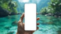 Handheld device in front of beautiful tropical islands, smartphone mockup Royalty Free Stock Photo