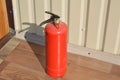 Handheld fire extinguisher to protect home and interior from fire Royalty Free Stock Photo