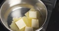 Handheld shot of butter melting in water Royalty Free Stock Photo