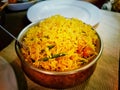 Handi biryni sweet pulao rice dish indian cuisine in a bowl on a table with white plates Royalty Free Stock Photo