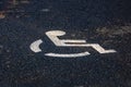 Handicap icon close up isolated. Parking lot with handicap sign and symbol. Empty reserved parking space with wheelchair symbol. Royalty Free Stock Photo