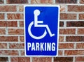 Handicap Parking Sign on Brick Wall