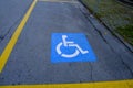 Handicap parking sign close-up written on the road. Top view. Transportation. Royalty Free Stock Photo