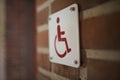 handicap sign on building wall Royalty Free Stock Photo