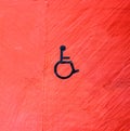 Handicap sign on red wall Royalty Free Stock Photo