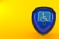 Handicap symbol inside shield