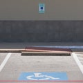 Handicap symbols on asphalt road, parking place reserved for disabled person or people Royalty Free Stock Photo