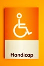 Modern orange color handicap toilet sign board background