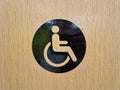 Handicap toilet sign on door logo