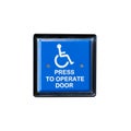 Handicapped access entrance pad on a wall. Royalty Free Stock Photo