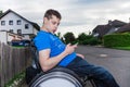 Handicapped boy with smartphone