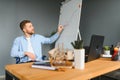 Handicapped Businessman Sitting On Wheelchair And Using Computer In Office Royalty Free Stock Photo