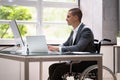 Handicapped Businessman Using Laptop Computer Royalty Free Stock Photo