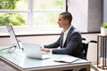 Handicapped Businessman Using Laptop Computer