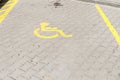 Handicapped disabled icon sign on parking lot or space area in car park in the city street