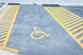 Handicapped disabled icon sign on parking lot or space area in car park in the city street