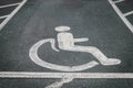 Handicapped / disabled parking sign painted on the road asphalt Royalty Free Stock Photo
