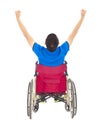 Handicapped man sitting on a wheelchair and raise arms