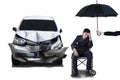 Handicapped man with umbrella and car