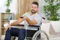 handicapped man using tv remote control Royalty Free Stock Photo