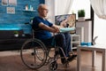 Handicapped old man in wheelchair training arm resistance exercising body muscle Royalty Free Stock Photo