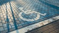 Handicapped parking bay. Reserved parking sign for disabled spaces disabled blue parking sign painted on dark asphalt Royalty Free Stock Photo