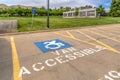 Handicapped parking lot with painted handicap symbol and Van Accessible sign