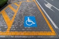 Handicapped parking marked by yellow lines Royalty Free Stock Photo