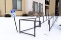 Handicapped Parking sign and wheelchair ramp at a snowy parking lot in winter Royalty Free Stock Photo