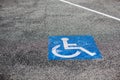 Handicapped parking spot, blue square on asphalt Royalty Free Stock Photo