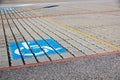 Handicapped parking spot - transportation infrastructure road markings and sign.