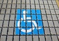 Handicapped parking spot - transportation infrastructure road markings and sign.