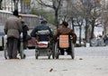 Handicapped people in wheelchairs on a street. Disabled person. Disadvantage people