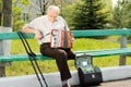 Handicapped senior man with an accordion Royalty Free Stock Photo