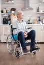 Handicapped senior man sitting in wheelchair Royalty Free Stock Photo