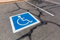 Handicapped symbol on a parking spot.