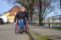 Handicapped woman keeping a wheelchair to the curb