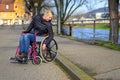 Handicapped woman manoeuvring her wheelchair Royalty Free Stock Photo