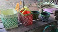 handicraft, basket made manually from plastic rope waste leather.