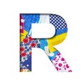 Handicraft or creative font. The letter R cut out of paper on the background of the texture of pieces of colored fabrics for home