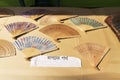 Handicrafts made of wood , Japanese fans, are being sold at Pingla village, India