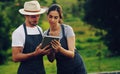 The handiest tool for horticulturalists. a young couple using a digital tablet together while working in a garden. Royalty Free Stock Photo